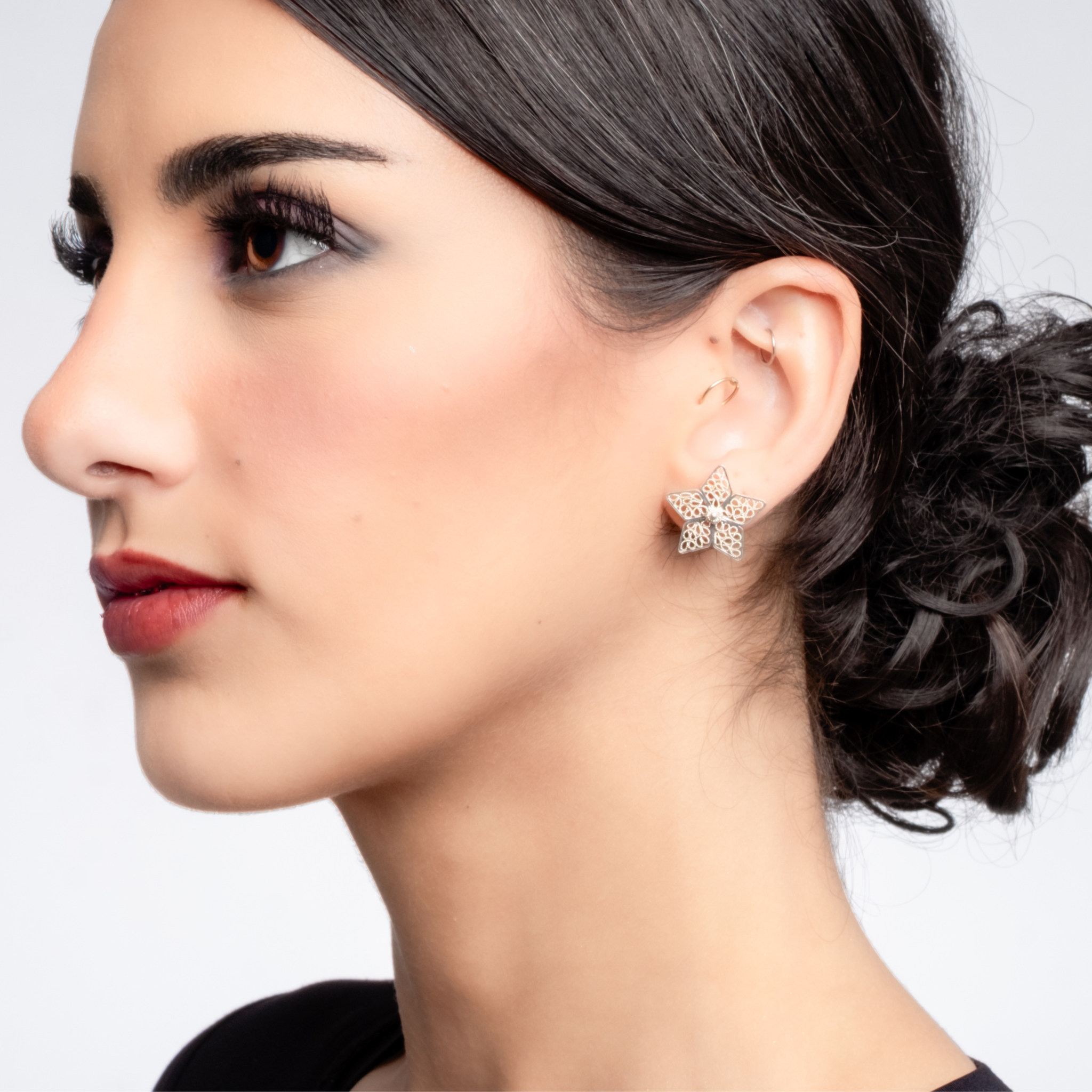 Woman wearing Celeste silver filigree  stud earrings by Valerosa