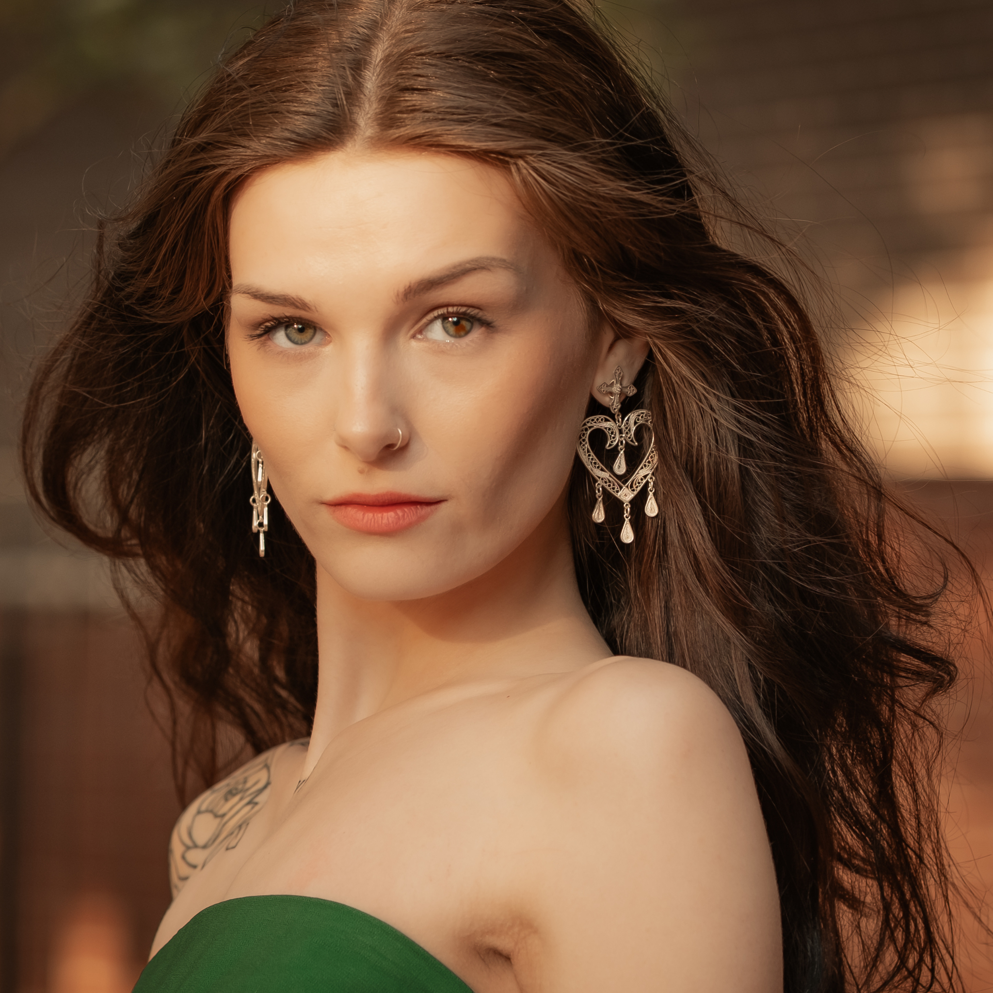 Woman wearing Dolores, handmade silver filigree MorphEar chandelier earrings by Valerosa
