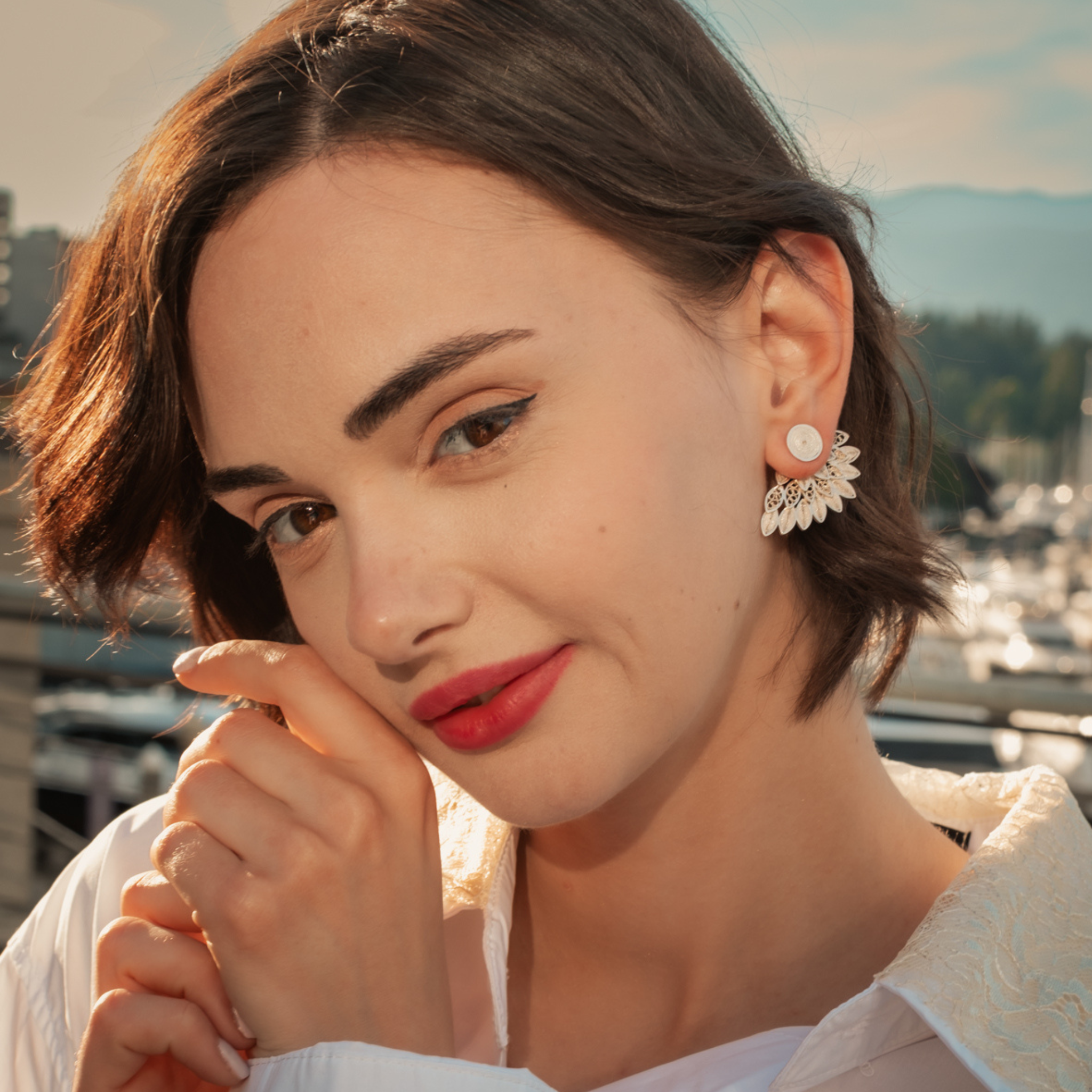 Woman wearing Fatima, handmade silver filigree MorphEar earrings