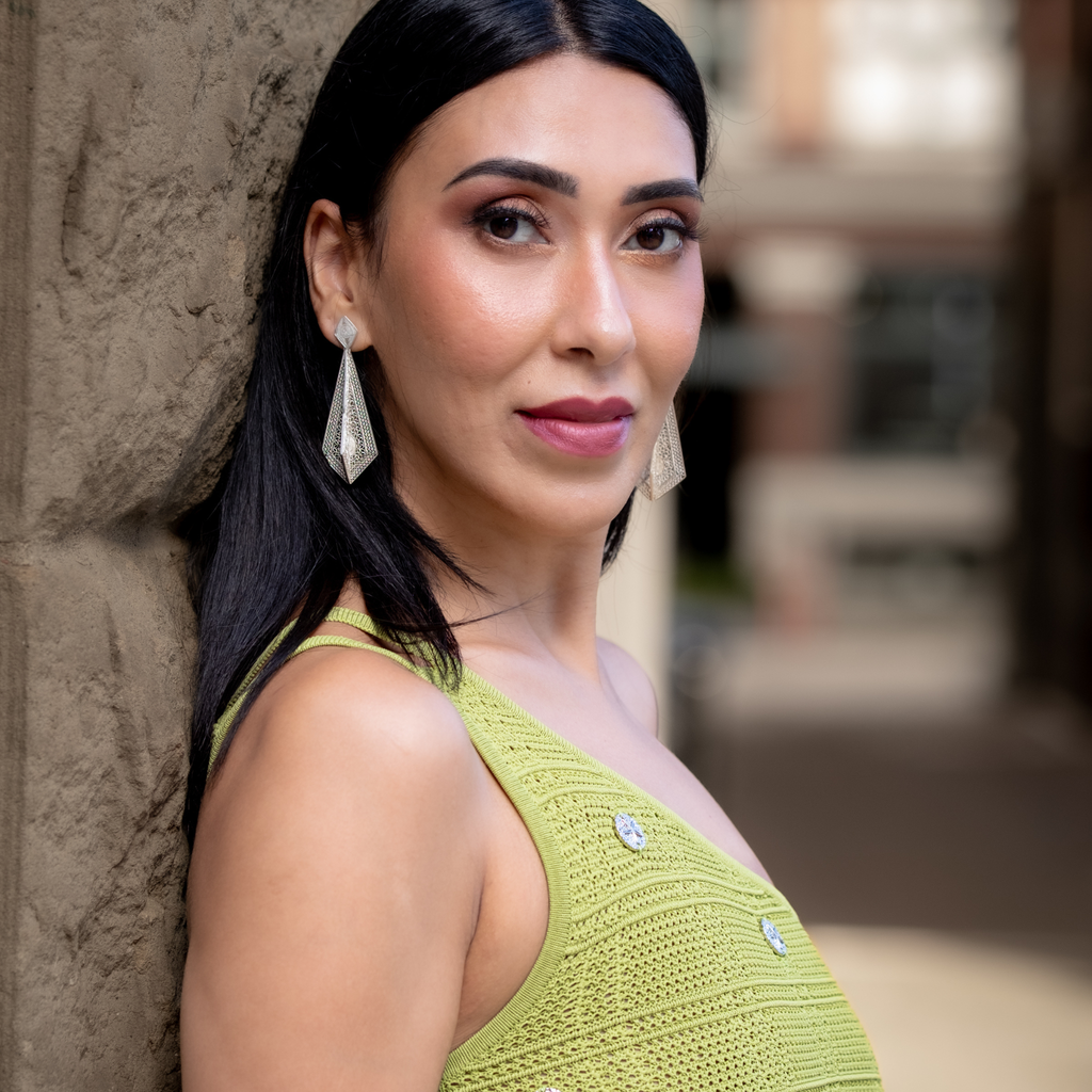 Woman wearing Rosario, handmade silver filigree MorphEar earrings by Valerosa 
