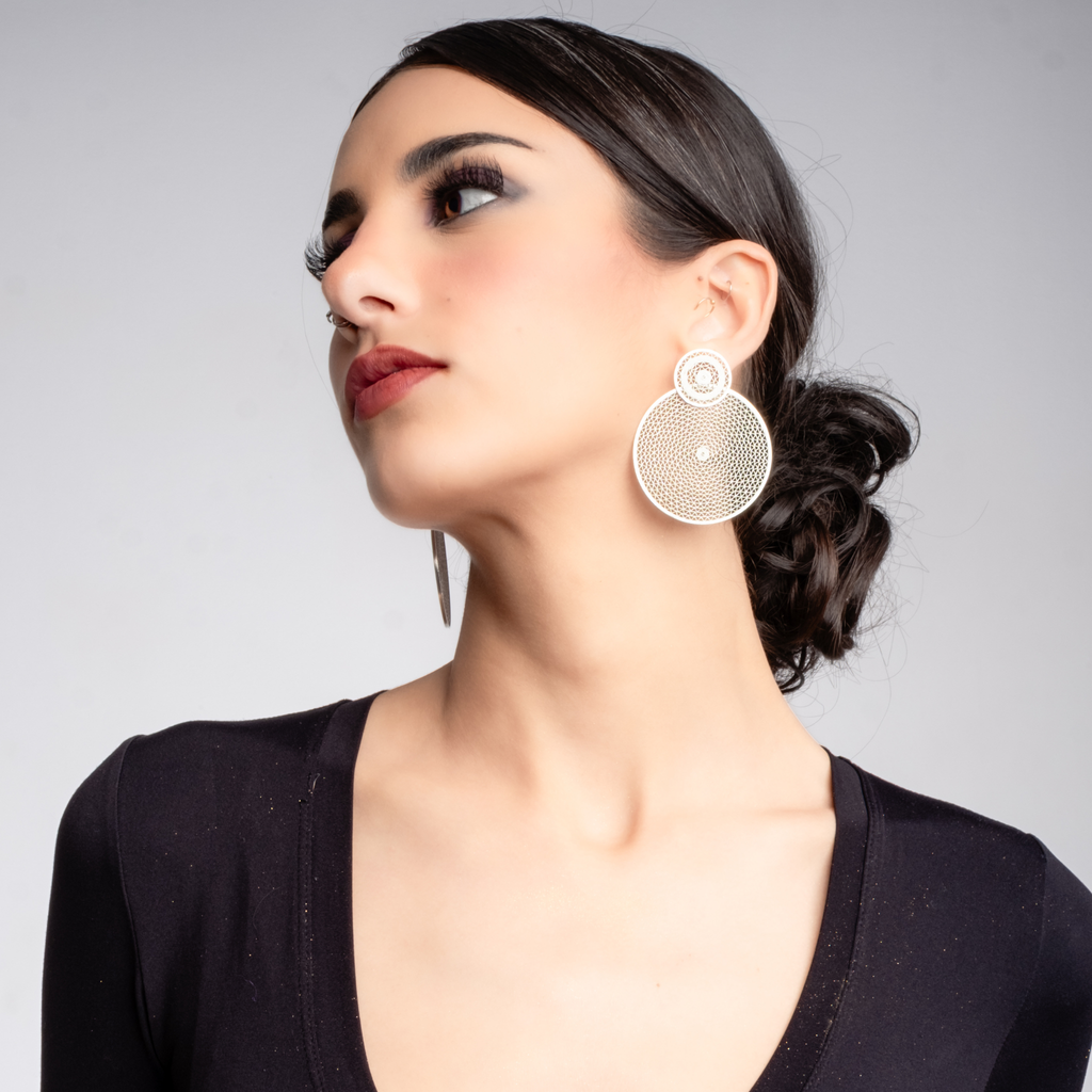 Woman wearing Sol, custom made MorphEar statement filigree earrings by Valerosa