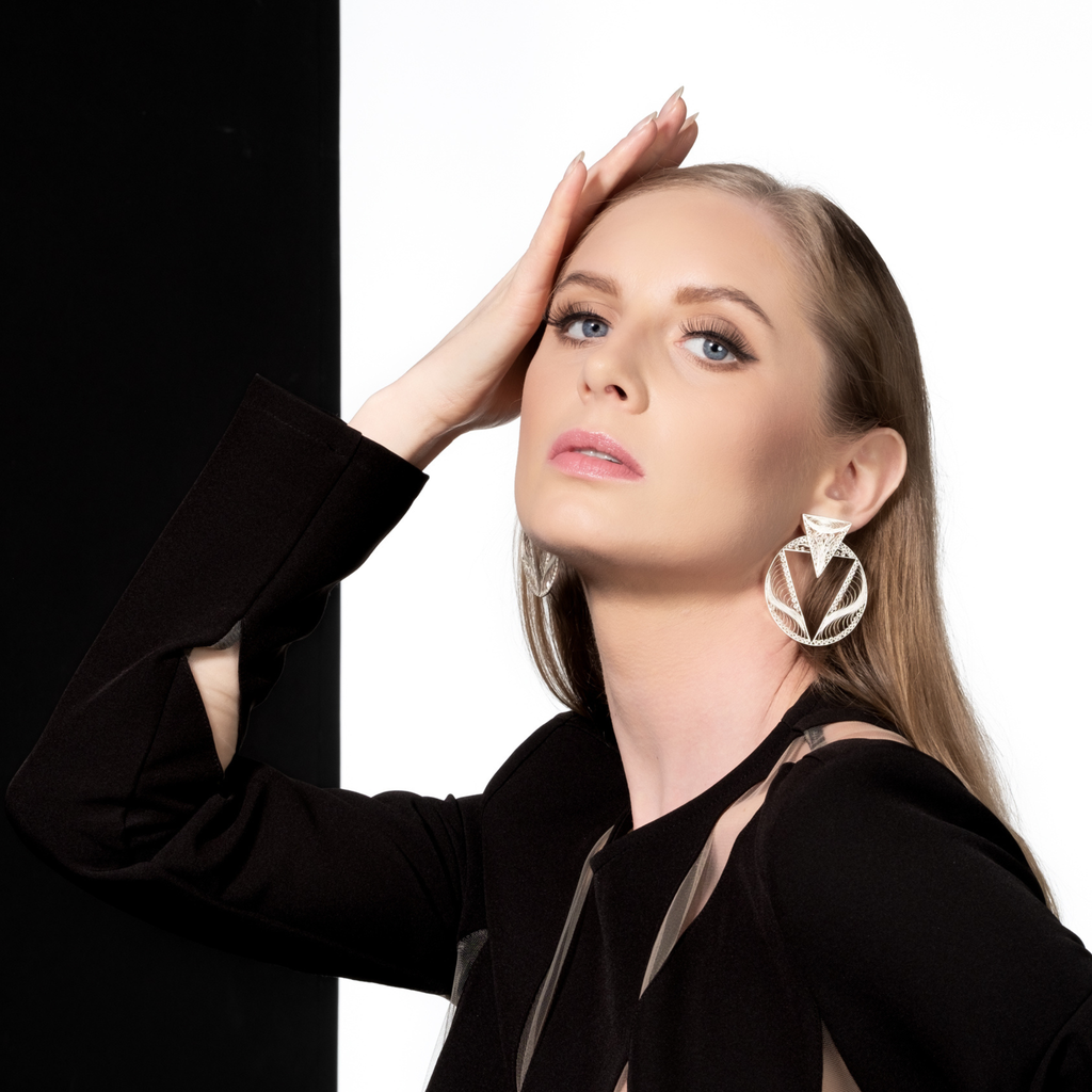 Woman wearing Valerosa, handmade silver filigree MorphEar earrings
