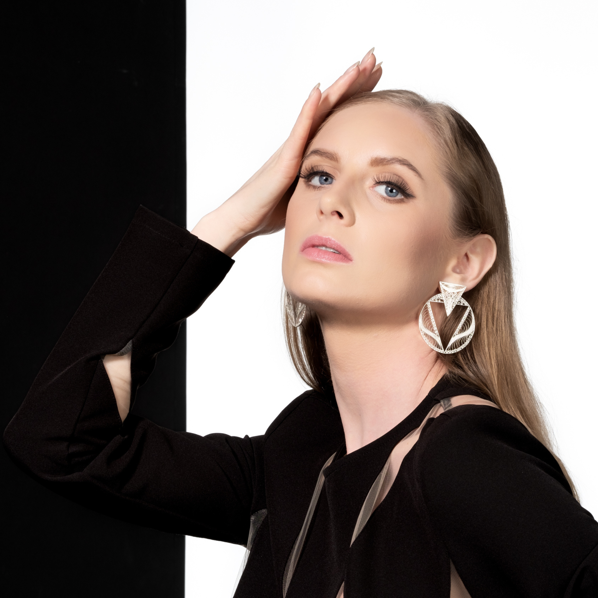 Woman wearing Valerosa, handmade silver filigree MorphEar earrings
