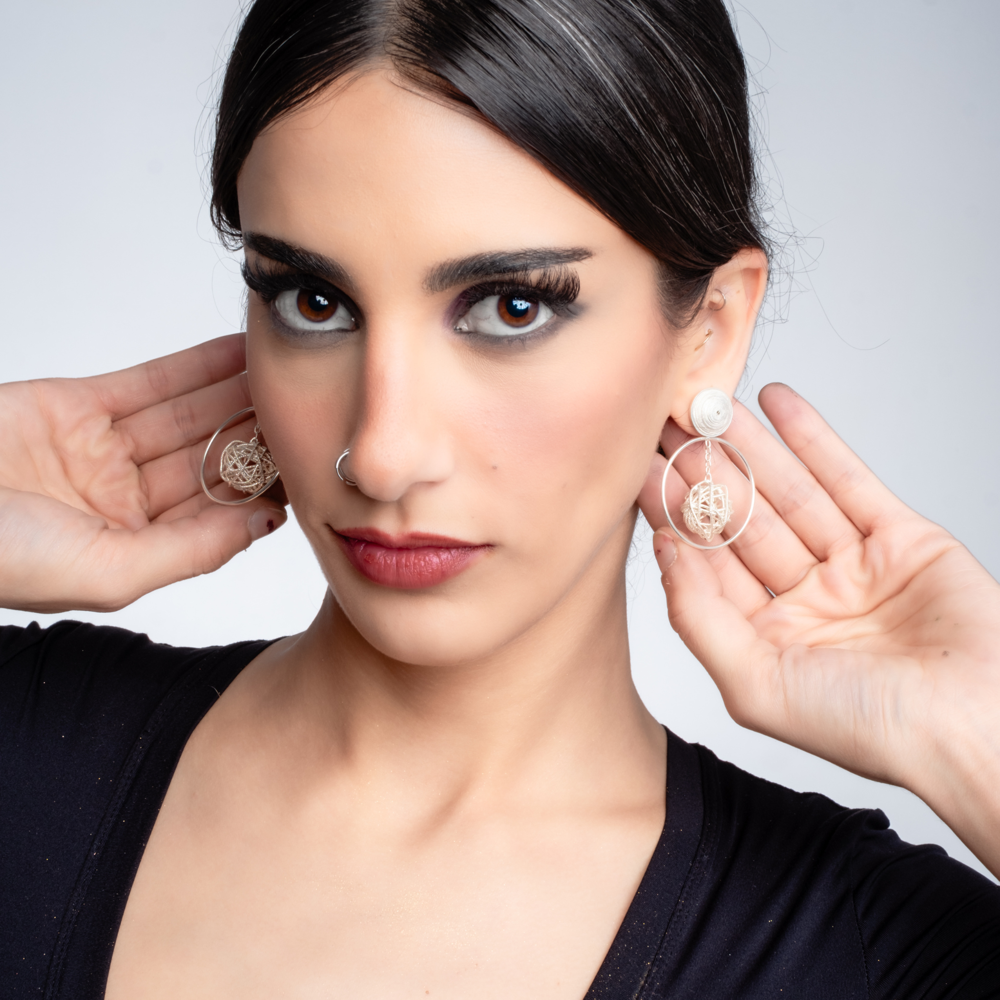 Woman wearing Aurora filigree MorphEar earrings by Valerosa. 