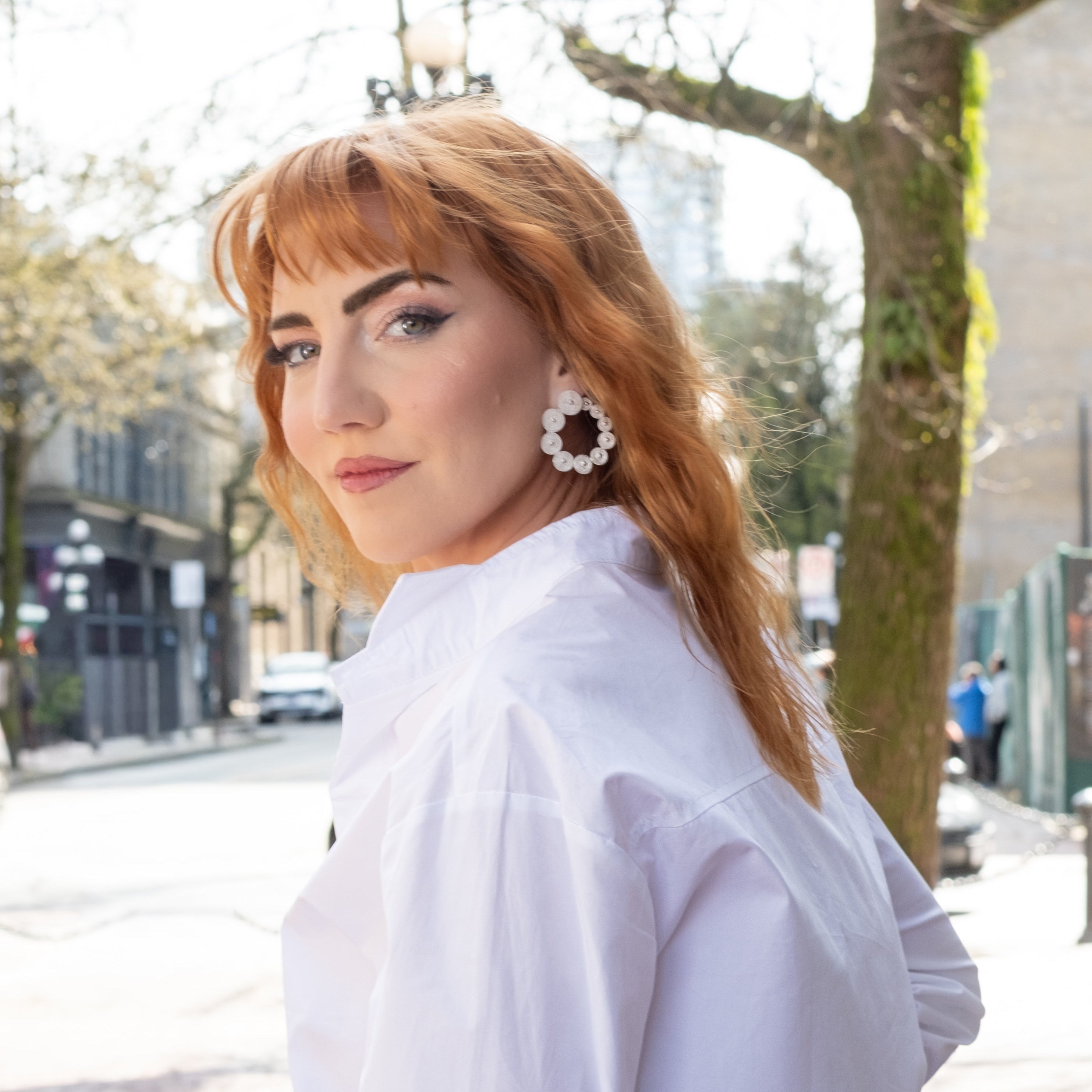 Woman wearing Estela, silver filigree earrings profile by Valerosa 
