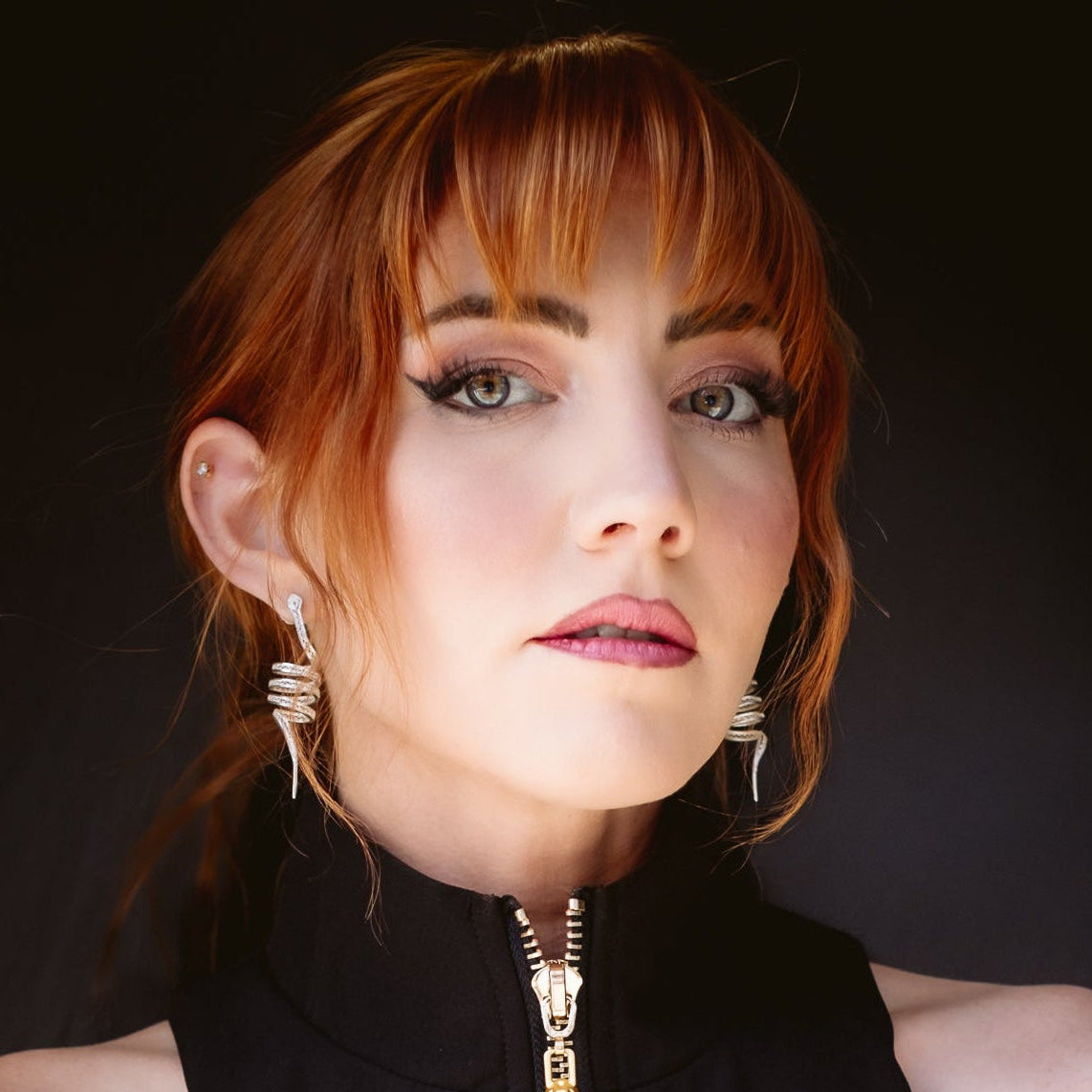 Woman wearing Arcadia silver filigree dangle earrings by Valerosa