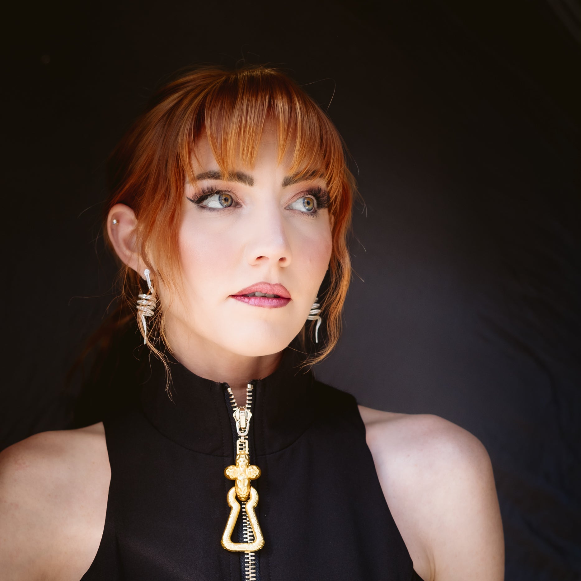 Woman wearing Arcadia silver filigree earring by Valerosa