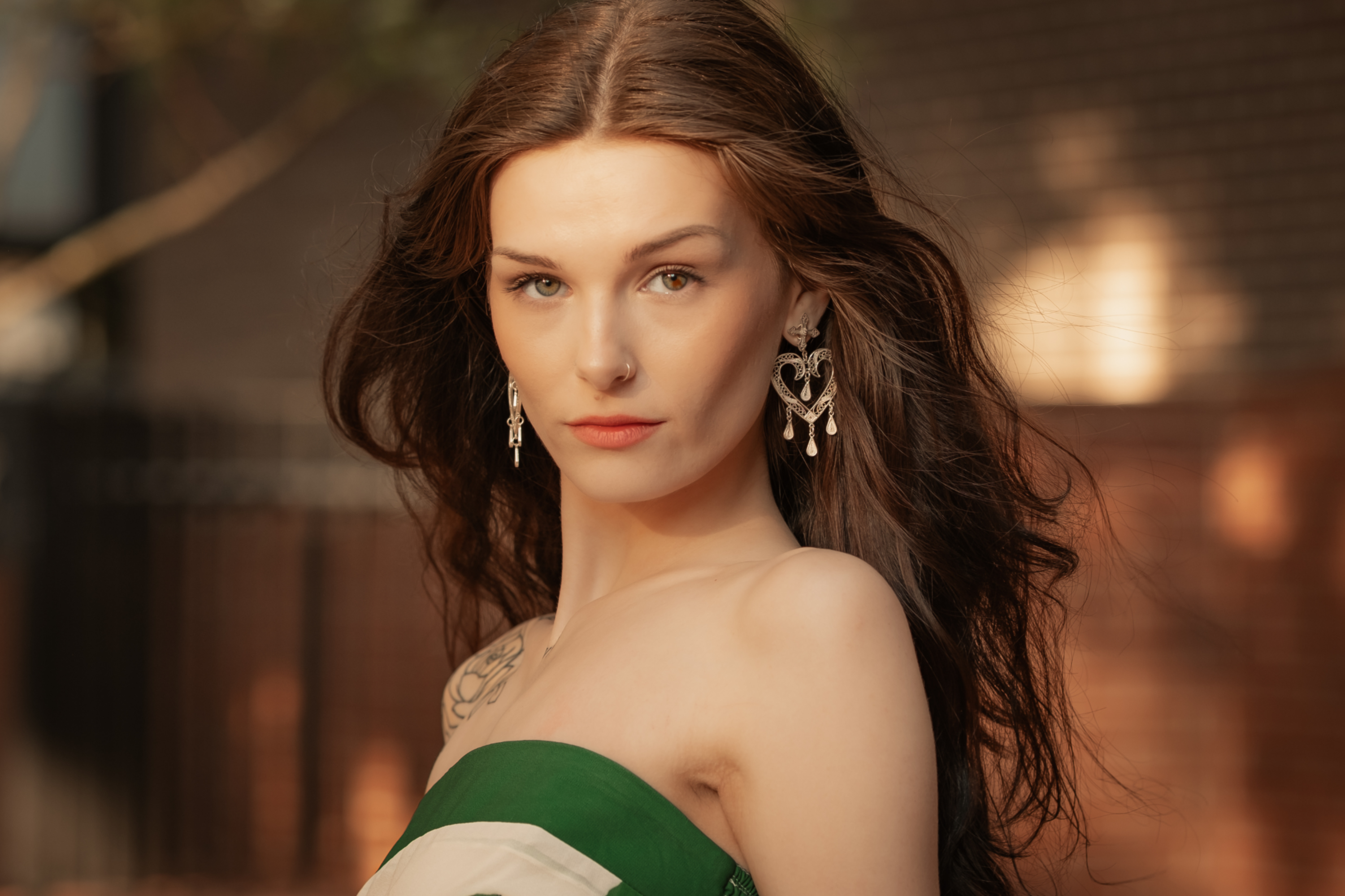Woman wearing Dolores, handmade silver filigree MorphEar earrings by Valerosa