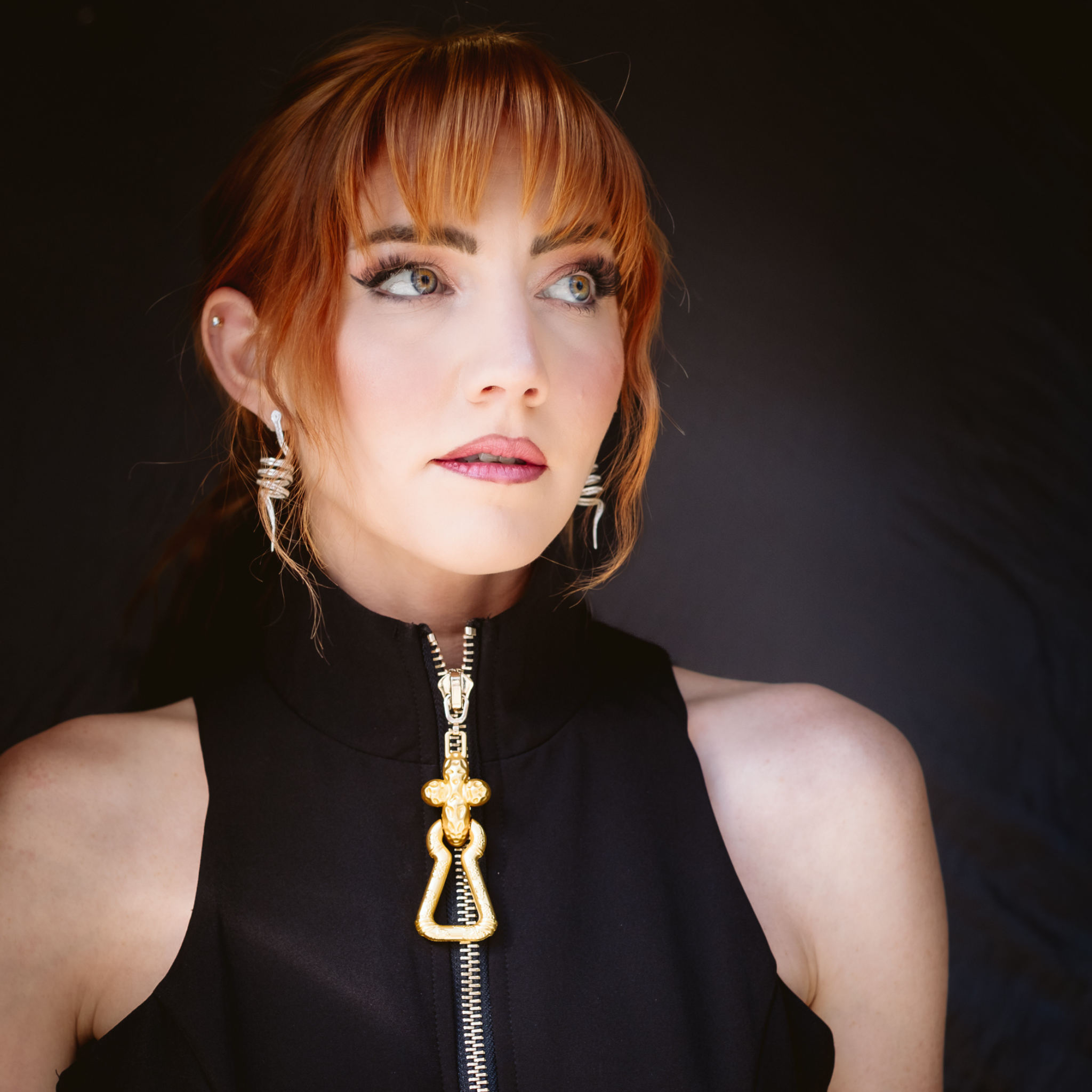Woman wearing Arcadia, handmade filigree earring by Valerosa 