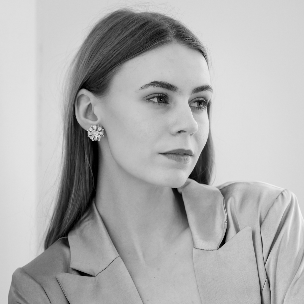 Woman wearing Milagros, handmade silver filigree MorphEar earrings by Valerosa
