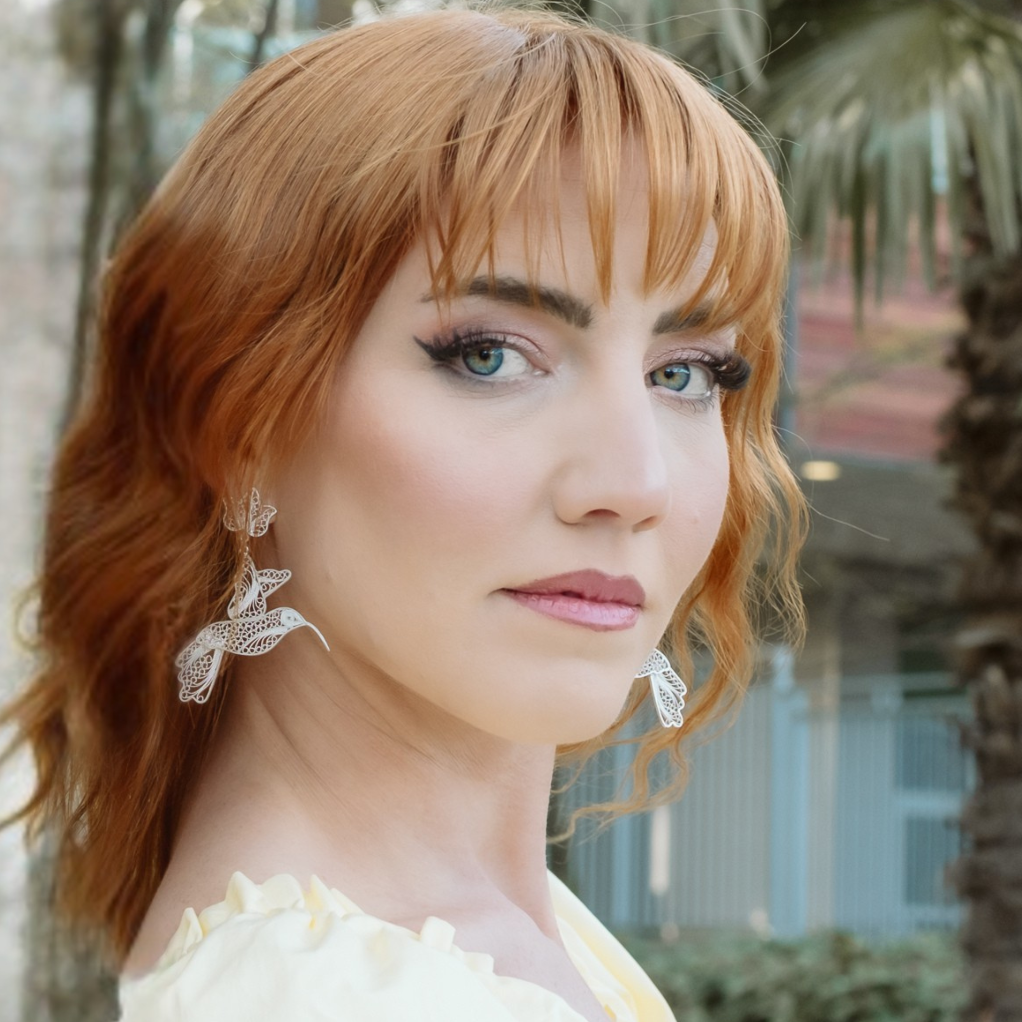 Woman wearing Amapola, silver filigree MorphEar dangle earrings by Valerosa