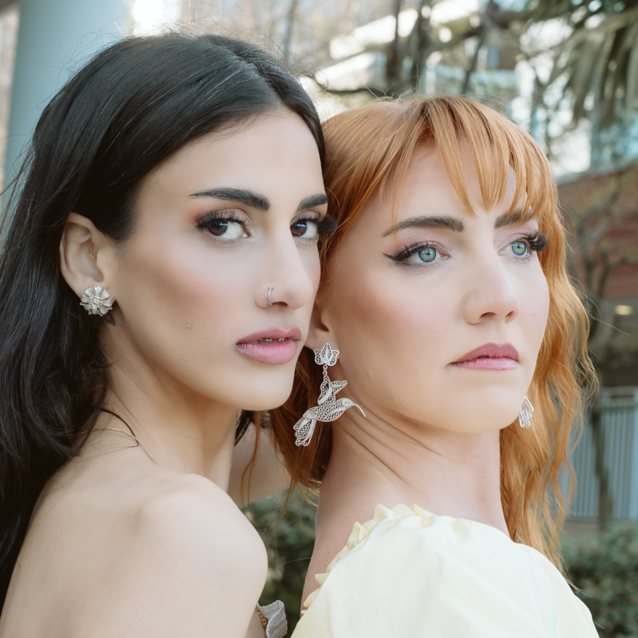 Woman wearing Amapola, silver filigree MorphEar earrings by Valerosa